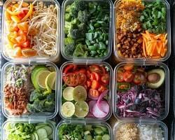 Variety-of-fruits-vegies-and-whole-grains Colorful meal prep containers filled with healthy ingredients like fruits, vegetables, and whole grains.